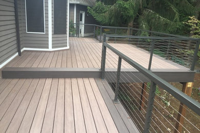 Inspiration for a mid-sized contemporary backyard deck remodel in Seattle with no cover