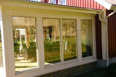 This is an example of a scandinavian sunroom in Other.