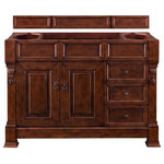 James Martin Vanities - Brookfield 48" Warm Cherry Single Vanity - The Brookfield 48" Warm Cherry vanity by James Martin Vanities features hand carved accenting filigrees and raised panel doors. Two doors open to shelves for storage below and two drawers, made up of a lower double-height drawer and a middle standard drawer, offer additional storage space. The look is completed with Antique Brass finish door and drawer pulls. Matching decorative wood backsplash is included.