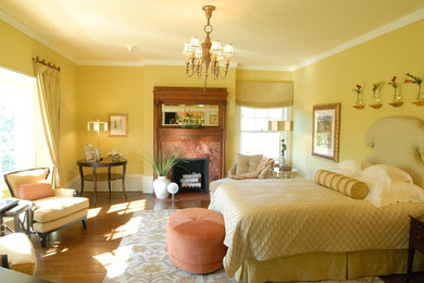 This is an example of a traditional bedroom in Chicago with yellow walls.