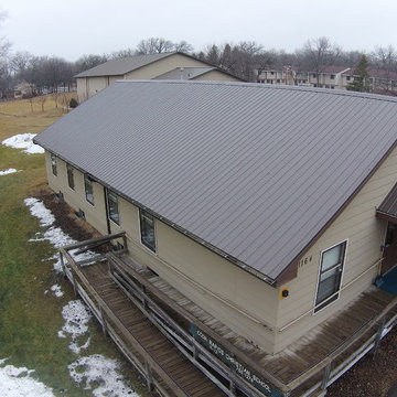 Metal roof and seamless gutters on a Church building