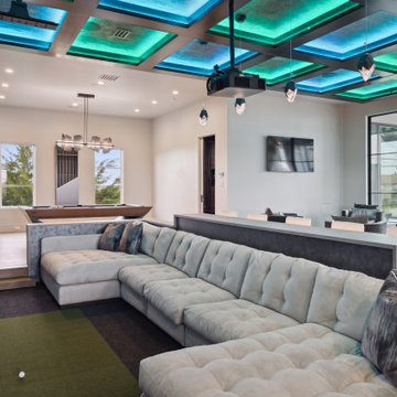 Stealth Pool Table, Custom Stealth Oval Poker Table, and Arella Cue Rack