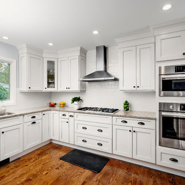 A modern Fusion Blanc kitchen with a built in coffee station
