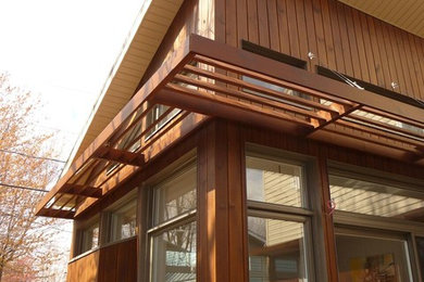 Example of a transitional exterior home design in Montreal