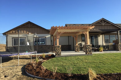 Example of an arts and crafts patio design in Denver