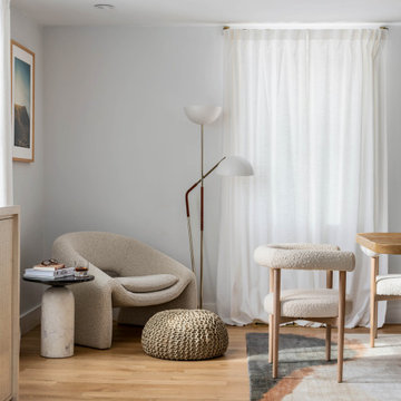 Scandi Reading Corner With Curved Lounge Chair and Marble Side Table