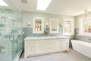 Large master gray tile and marble tile marble floor and white floor bathroom photo in Portland with shaker cabinets, white cabinets, white walls, an undermount sink, marble countertops and a hinged shower door
