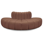 Meridian Furniture - Arc Upholstered Outward Curved Modular Sectional, Cognac, 4-Piece: 4 Reverse Corner, Vegan Leather - Unleash modern opulence with the Arc Vegan Leather 4pc. Sectional. Crafted for the modern connoisseur, this Sectional injects an air of refined luxury into any space. Its sleek silhouette, upholstered in supple cognac vegan leather, exudes timeless sophistication while the deep channel tufting adds textural intrigue, further elevating the chair's visual appeal. The modular design makes it a versatile chameleon, effortlessly adapting to your evolving needs and preferences. Whether you envision it gracing a chic living room corner, basking in the glow of a bedroom window, or adding a touch of drama to a home office, the Arc seamlessly complements your unique interior aesthetic.