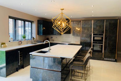 Photo of a medium sized contemporary l-shaped kitchen/diner in London with a built-in sink, flat-panel cabinets, distressed cabinets, quartz worktops, yellow splashback, engineered quartz splashback, integrated appliances, ceramic flooring, an island, beige floors and white worktops.