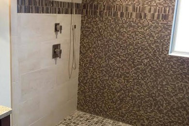 Inspiration for a master mosaic tile corner shower remodel in Other