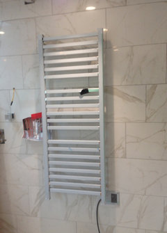 towel warmer. waster of space or must have?