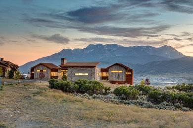 Large wood exterior home idea in Salt Lake City with a metal roof