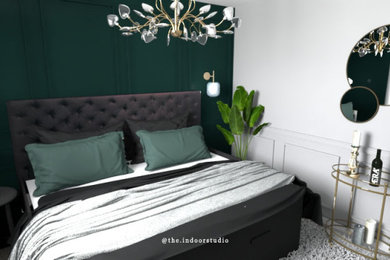 Idée de décoration pour une petite chambre d'amis minimaliste avec un mur vert et un sol en bois brun.