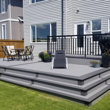 Custom 2 level Fiberon deck with welded railing and wrap around stairs