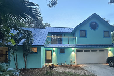 Example of a trendy two-story exterior home design in Miami