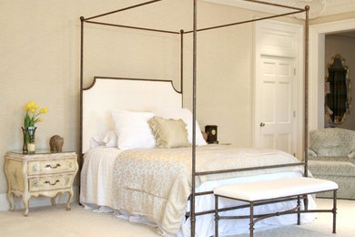 Inspiration for a large timeless master bedroom remodel in Los Angeles with beige walls