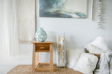 Small transitional guest bedroom photo in Austin with white walls and no fireplace