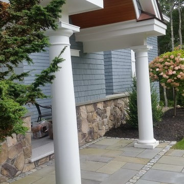 An extensive landscape project with stonewalls, patio, dry river bed & more