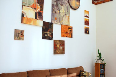 Inspiration for a large contemporary formal and open concept light wood floor living room remodel in Boston with multicolored walls, a standard fireplace and a wood fireplace surround