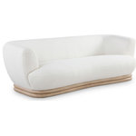 Meridian Furniture - Kipton Boucle Fabric Upholstered Sofa, Cream - Add an elegant touch to your living room with this eye-catching Kipton sofa from Meridian Furniture. Featuring a rubber wood frame upholstered with rich cream boucle fabric this sofa is both soft and comfortable to kick back and relax in. Its solid rubber wood base in a natural oak finish provides a splash of color to this cream piece, making it a stunning addition to your living area, while its curved back makes it an extra cozy place to sit.