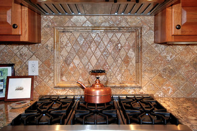 Example of a mid-sized arts and crafts l-shaped kitchen design in Albuquerque with an undermount sink, raised-panel cabinets, medium tone wood cabinets and granite countertops