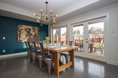 Inspiration for a mid-sized contemporary concrete floor and gray floor great room remodel in Vancouver with white walls and no fireplace
