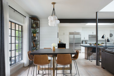 Dining room - mid-sized contemporary light wood floor and beige floor dining room idea in New York with white walls