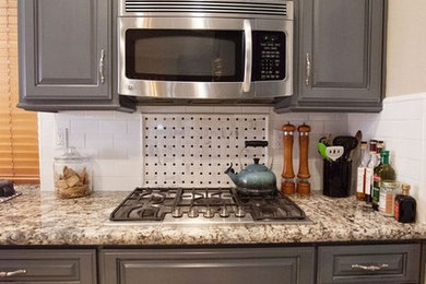 Transitional ceramic tile and beige floor kitchen photo in Other with raised-panel cabinets, gray cabinets, granite countertops, white backsplash, subway tile backsplash and stainless steel appliances