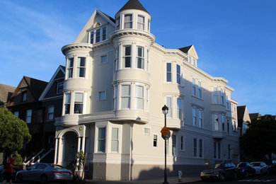 Large ornate white three-story exterior home photo in San Francisco