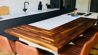 Solid surface worktop with wooden breakfast bar