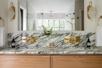 Mid-sized transitional master white tile and porcelain tile double-sink bathroom photo in Chicago with shaker cabinets, light wood cabinets, white walls, an undermount sink, marble countertops, a hinged shower door, white countertops and a built-in vanity