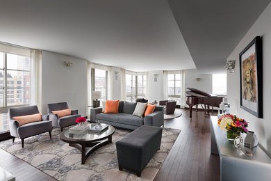 Inspiration for a transitional open concept dark wood floor living room remodel in New York with white walls