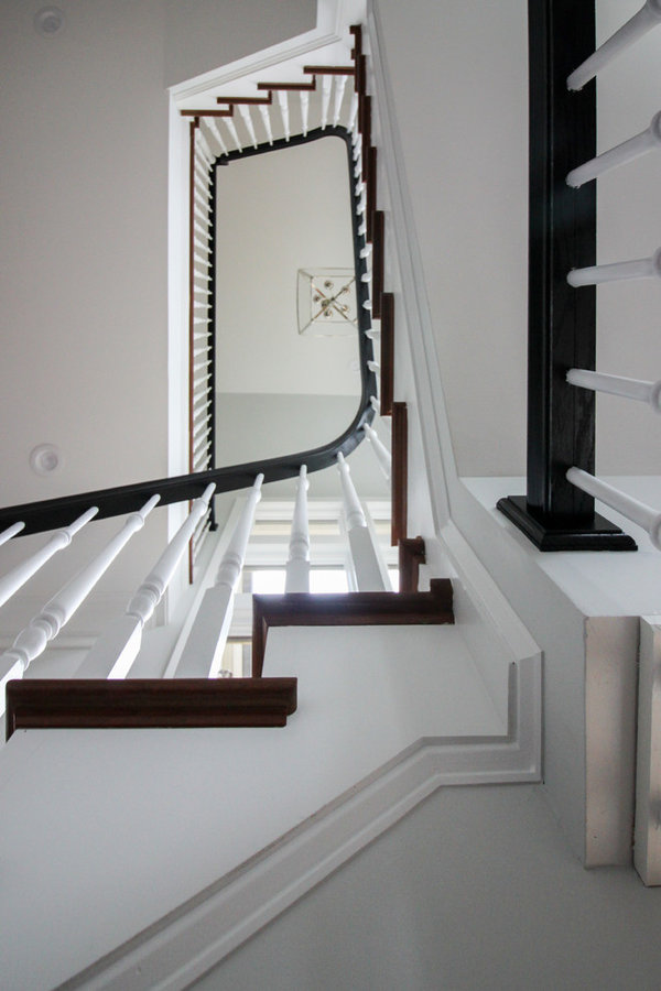 Powerful Impression by Floating Staircase in Suburban Foyer