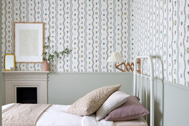 Inspiration for a medium sized modern children’s room for girls in Wiltshire with green walls.