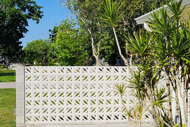 Inspiration for a large modern full sun front yard garden path in Tampa.