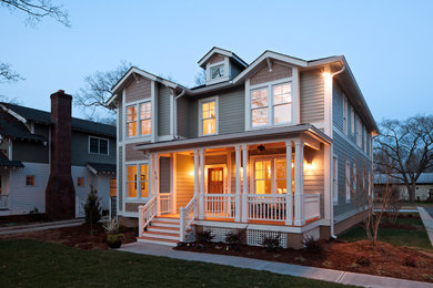 Mid-sized elegant gray two-story wood house exterior photo in Raleigh with a hip roof and a shingle roof