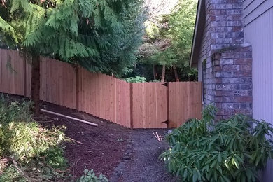 Mid-sized traditional wood exterior home idea in Seattle
