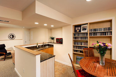 Inspiration for a transitional walk-out carpeted basement remodel in Baltimore with beige walls
