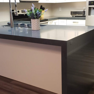 White Shaker with Waterfall edge Silestone countertop