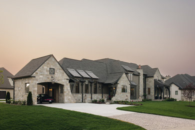 Huge traditional gray three-story wood and shingle house exterior idea in Other with a hip roof, a mixed material roof and a black roof