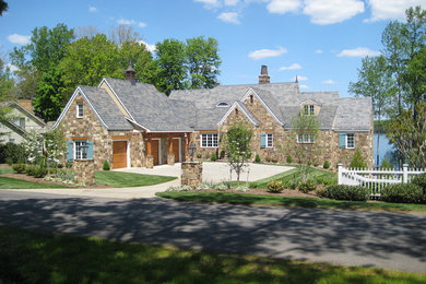 Inspiration for a mid-sized timeless two-story stone exterior home remodel in Richmond