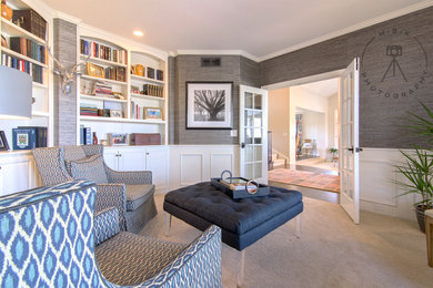 Home office library - mid-sized carpeted and beige floor home office library idea with brown walls