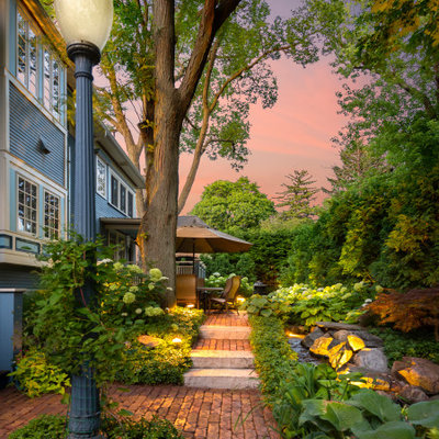 Inspiration for a small timeless backyard brick patio remodel in Chicago