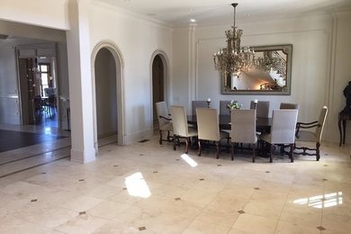 Inspiration for a mid-sized timeless travertine floor dining room remodel in Atlanta