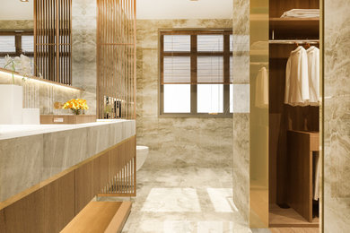 Bathroom - large mid-century modern master beige tile and porcelain tile ceramic tile, beige floor, double-sink, tray ceiling and wall paneling bathroom idea in San Francisco with flat-panel cabinets, light wood cabinets, a one-piece toilet, brown walls, a drop-in sink, onyx countertops, beige countertops and a floating vanity