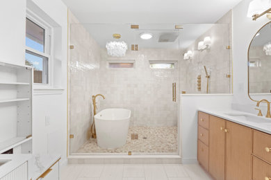 Inspiration for a large contemporary master white tile and ceramic tile beige floor, double-sink and porcelain tile bathroom remodel in Dallas with white walls, a hinged shower door, a built-in vanity, furniture-like cabinets, light wood cabinets, marble countertops, white countertops, a two-piece toilet and an undermount sink