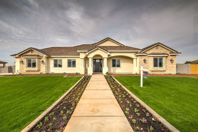 Example of a beige exterior home design in Phoenix