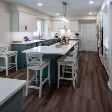 Custom Two-Toned Green and White Kitchen with Laventa Carrara Quartz Countertops