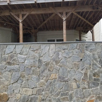 C-Stamped concrete patio with a wall