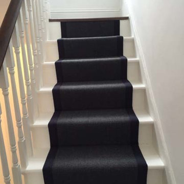 Black Carpet with Black Binding Installed to Stairs